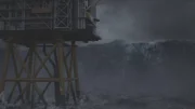 A rogue wave hits an oil rig.