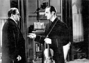 Basil Rathbone as Sherlock Holmes(r.)
