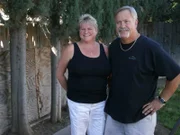 Rick and Lorie Knudson pose in the their old backyard, as seen on My Lottery Dream Home. (portrait)