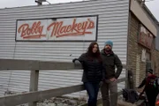Hosts Katrina Weidman and Jack Osbourne posing in front of the Bobby mackey's sign in Kentucky.