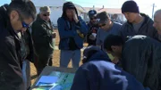 Townspeople use a map to determine George Roberts’ last known position.Townspeople use a map to determine George Robertsâ€™ last known position.