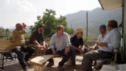 Rock Raiders, Farouk and a Bauxite miner discussing Zultanite deposits at the Bauxite miner’s house.