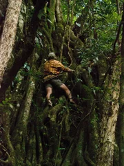 Cody Lundin descending a wall of ficus roots.