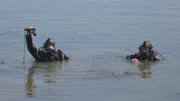A diver found a gun in the lake.