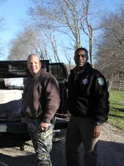 Wardens and Sgt Prewitt pose with a severed deer head.