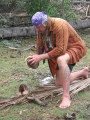 Cody Lundin cracking a coconut in Dominican Republic.