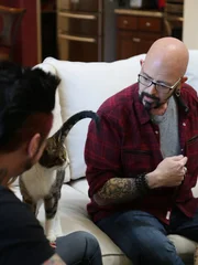 Jackson talks to Jason and Stefanie in the living room with Farnsworth.
