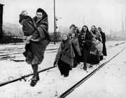 Berlin. This handful of women and children are all that survived from 150 persons who left Lodz, Poland, to trek to Berlin. All the other people died by the wayside, overcome with hunger and exposure. These plodded on, hoping to find the end of their troubles in Berlin, but the German capital they remembered is no more. It is a waste as barren as any they passed through on the terrible journey. Hundreds of thousands of displaced persons like these are facing the hardest winter of their lives in the war-torn continent.
