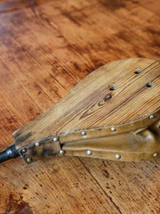 Vintage fire blower on wooden table