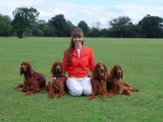 Vicki with dogs on the lawn, taken by her husband, Van Stilwell