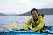 Alta, Norway - Albert Lin kayaking in Alta, Norway. (National Geographic/Hugh Campbell)