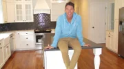 David Bromstad poses in the kitchen of one of the dream homes, as seen on My Lottery Dream Home.