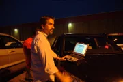 Baltimore, MD USA: Lieutenant Lee Dunbar, Watch Commander of the Harford County Narcotics Task Force on nighttime survelliance.