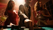 Ed Shin with two women gambling at a casino.