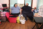 Vianey and Allen are on a couch, packing.