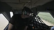 YUKON RIVER, ALASKA- Austin searches from the air for the broken down ship he's due to repair.
