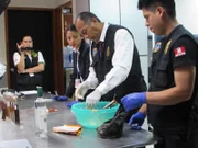 LIMA - Drug in can being poured.
