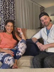 Veronica laughs, and Tim smiles.