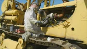 SALCHA, ALASKA- Jim Evridge replaces a hose on the Frankendozer engine.