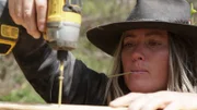 Misty Raney drills in a nail.