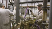 BEAVER, ALASKA- Jim and Austin hoist the bad generator out.