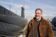 Dr Innes Macartney, Marine Archaeologist, Bournemouth University, with HMS Alliance, World War II submarine