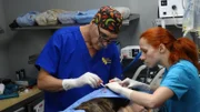 Dr. Jeff and Petra work on Walter in the OR.
