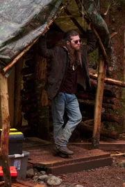 Bam Brown standing at the entrance to his home.
