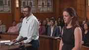 A man and woman standing in courtroom