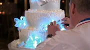 Cake Boss dressing the cake.