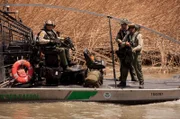 Laredo, TX: Customs and Border Protection officers patrollingthe water for drug runners crossing the border. (Photo Credit: © NGT)