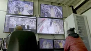 Officers watching the cameras, watching for suspicious activity.