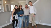 David Bromstad poses in the living area with the winners