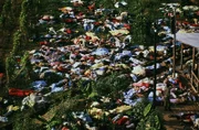Dead bodies litter the ground after a mass suicide of the People's Temple cult followers, led by Jim Jones.