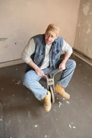Dan takes a seat on the lone tricycle found in one of the church offices.
