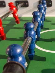 Table football game with red and blue players team