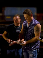 JJ Da Boss casually counts out the cash bets for round two of JJ's Arm Drop.