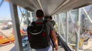 Darryl with a bag on his back.