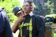 Dustin Hurt is strapped into dive suit.