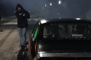 Shane lines up for a burnout before racing Daddy Dave.