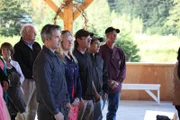 Dustin, his girlfriend Danielle and miners Paul, Carlos and Wes watch the ceremony from the front row.
