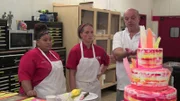 Liz, Mauro and Jessica step back to look at completed Brush Stroke Cake.