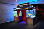 An old photo booth in an aquarium.