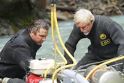 L-R: Dustin and Fred Hurt in their dive suits inspecting the dredge.