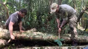 Josh James and Grady Powell tying logs together in Nicaragua.