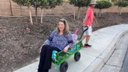 Alisha Williams being pulled by companion in Wagon