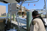 Fish and Game Officers Lerrin Johnson and Albert Flores gearing up for a day of water safety checks.