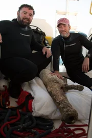 Darrell Miklos and Eric Schmitt posing with cannon.