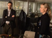 During the search for Ennis, an unpredictable criminal, Sherlock (Jonny Lee Miller, left) is forced to work alongside Kathryn Drummond (Kari Matchett), the FBI profiler who literally wrote the book on him, on a special night, immediately following the Super Bowl.