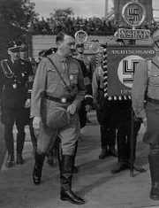 ca. 1936-1945, Germany --- Adolf Hitler walks among Nazi officers and men at a rally in Germany ca. 1936-1945. --- Image by © CORBIS